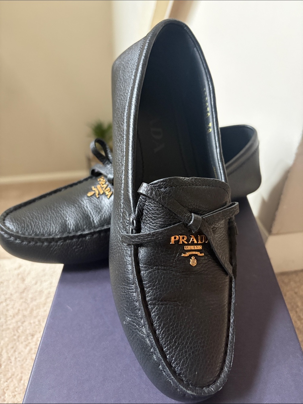 Prada Black Leather driving shoes with Gold Logo.